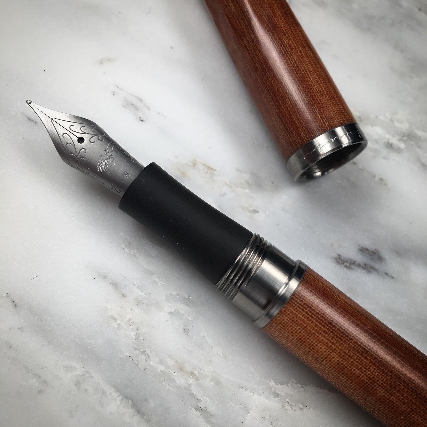 Model 4. Faceted Linen Micarta Fountain Pen with Titanium Hardware