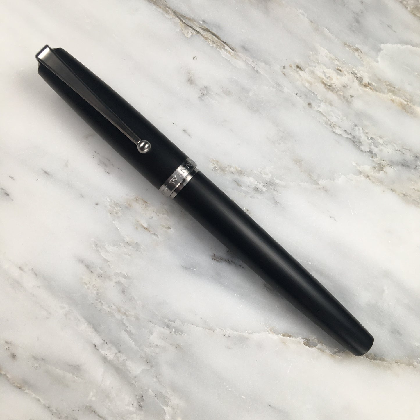 Model 1. Ebonite Fountain Pen with Titanium Waterfall Clip and Hand-Scraped Titanium Grip
